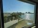 Enjoy a scenic water view from the comfort of your home, featuring palm trees and upscale residences at 5930 Bahama N Way, St Pete Beach, FL 33706