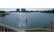 Scenic waterfront view showcasing calm waters with the reflection of the skyline in the distance at 5930 Bahama N Way, St Pete Beach, FL 33706