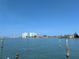 Expansive waterfront view showcases luxury condos and waterfront homes in a serene coastal setting at 5930 Bahama N Way, St Pete Beach, FL 33706