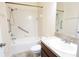 Well-lit bathroom showcasing a tub-shower combination and a wooden vanity at 621 Washita Stone Dr, Ruskin, FL 33570