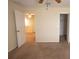 Spacious bedroom with a ceiling fan, walk-in closet, and view of the home's second floor at 621 Washita Stone Dr, Ruskin, FL 33570