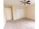 Bedroom with carpet, ceiling fan, and double closet at 621 Washita Stone Dr, Ruskin, FL 33570