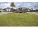 Charming community clubhouse featuring lush green spaces and palm trees at 621 Washita Stone Dr, Ruskin, FL 33570