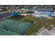 Aerial view of community amenities including pool, playground, splash pad, and basketball court at 621 Washita Stone Dr, Ruskin, FL 33570