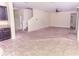 A spacious living room with neutral carpet and plenty of light at 621 Washita Stone Dr, Ruskin, FL 33570