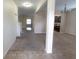 Open floor plan with tile flooring, carpeted living area, and neutral paint at 621 Washita Stone Dr, Ruskin, FL 33570