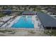 Aerial view of the pool featuring lounge seating, a splash pad, and Gathering fun at 621 Washita Stone Dr, Ruskin, FL 33570
