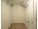 Empty walk-in closet with wire shelving, offering ample storage space for clothing and accessories at 621 Washita Stone Dr, Ruskin, FL 33570