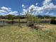 Backyard featuring views of the pond and neighboring homes in the distance at 6244 English Hollow Rd, Tampa, FL 33647