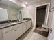 Bathroom featuring double sinks and granite countertops at 6244 English Hollow Rd, Tampa, FL 33647