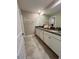 Bathroom featuring a double vanity sink with granite countertops and tile floors at 6244 English Hollow Rd, Tampa, FL 33647