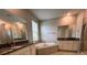 Bathroom showcasing dual sinks, granite countertops, a tub, and a shower at 6244 English Hollow Rd, Tampa, FL 33647