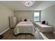 Cozy bedroom featuring two beds, a dresser, and natural light. Perfect for relaxation at 6244 English Hollow Rd, Tampa, FL 33647