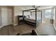 Bedroom with a four-poster bed, a ceiling fan, and wood-look flooring at 6244 English Hollow Rd, Tampa, FL 33647