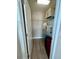 Walk-in closet with built-in shelving and wood-look flooring at 6244 English Hollow Rd, Tampa, FL 33647