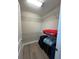 Walk-in closet with metal shelving and wood floors, perfect for organization at 6244 English Hollow Rd, Tampa, FL 33647