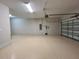 Spacious two-car garage with ample room for parking and storage, plus a clean, epoxy floor at 6244 English Hollow Rd, Tampa, FL 33647