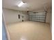 Garage featuring epoxy flooring, automated door, and ample space at 6244 English Hollow Rd, Tampa, FL 33647