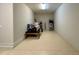 Spacious garage featuring epoxy flooring and room for additional storage at 6244 English Hollow Rd, Tampa, FL 33647