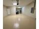 Spacious garage featuring epoxy flooring and ample room for storage and parking at 6244 English Hollow Rd, Tampa, FL 33647