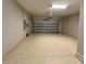 Garage featuring epoxy flooring, automated door, and ample space at 6244 English Hollow Rd, Tampa, FL 33647