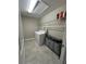 A laundry room with washer, dryer, and overhead shelving at 6244 English Hollow Rd, Tampa, FL 33647