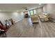 Bright, open living space featuring hardwood floors, a ceiling fan, and recessed lighting at 6244 English Hollow Rd, Tampa, FL 33647