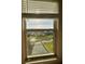 A bright window showing the view of the green lawn and pond, enhancing the room's appeal at 6244 English Hollow Rd, Tampa, FL 33647