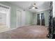 Bedroom features carpet, ceiling fan, and a closet with sliding doors at 6307 S Cameron Ave, Tampa, FL 33616