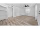 Neutral bedroom with stylish flooring, a ceiling fan, a closet and a bright window at 6307 S Cameron Ave, Tampa, FL 33616