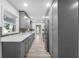 Modern kitchen boasts gray cabinets, stainless steel appliances, and tile backsplash at 6307 S Cameron Ave, Tampa, FL 33616