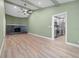 Open living room showcasing a fireplace, vaulted ceiling, and wood floors at 6307 S Cameron Ave, Tampa, FL 33616