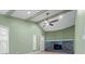 Living room with vaulted ceiling, fireplace, ceiling fan, and neutral paint at 6307 S Cameron Ave, Tampa, FL 33616