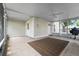 Enclosed patio with tile floors, ceiling fan, and view of backyard at 6307 S Cameron Ave, Tampa, FL 33616