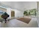 Spacious enclosed patio with outdoor lighting and view of lush backyard at 6307 S Cameron Ave, Tampa, FL 33616