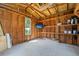 Shed interior with shelving, a window, and room for storage and equipment at 6307 S Cameron Ave, Tampa, FL 33616