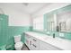 Stylish bathroom featuring a modern vanity, vibrant green tiles, and a sleek design at 6811 N Himes Ave, Tampa, FL 33614