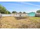 Fenced backyard featuring a utility shed and patio at 6816 13Th N St, St Petersburg, FL 33702
