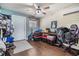 Bonus room with hardwood floors, ceiling fan, and a door to the exterior at 6816 13Th N St, St Petersburg, FL 33702