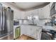 Modern kitchen features stainless steel appliances, white cabinets, and ample counter space at 6816 13Th N St, St Petersburg, FL 33702