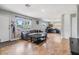Open-concept living room with work space and natural light showcases the home's layout at 6816 13Th N St, St Petersburg, FL 33702