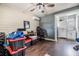 Home office featuring wood-look floors, overhead fan, and storage at 6816 13Th N St, St Petersburg, FL 33702