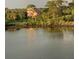 Exterior view of the home showcasing its scenic waterfront location and lush green surroundings at 6926 Mccray Dr, Hudson, FL 34667