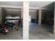 Spacious garage with boat, motorcycle and ample room for storage and a ceiling fan at 6926 Mccray Dr, Hudson, FL 34667