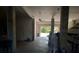 An oversized garage with a door to the yard, a ceiling fan and concrete floors at 6926 Mccray Dr, Hudson, FL 34667