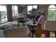 Comfortable living room featuring plush seating, a colorful rug, and a glimpse of the serene outdoor view at 6926 Mccray Dr, Hudson, FL 34667