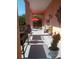 Outdoor patio with a red umbrella perfect for enjoying the outdoors at 6926 Mccray Dr, Hudson, FL 34667
