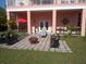 Outdoor patio with comfortable seating and lush landscaping at 6926 Mccray Dr, Hudson, FL 34667