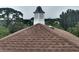 Close up of the shingled roof and white cupola in the community at 6926 Mccray Dr, Hudson, FL 34667