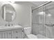 A bathroom with a vanity, a toilet, and a glass-enclosed shower at 7360 Ulmerton Rd # 17D, Largo, FL 33771